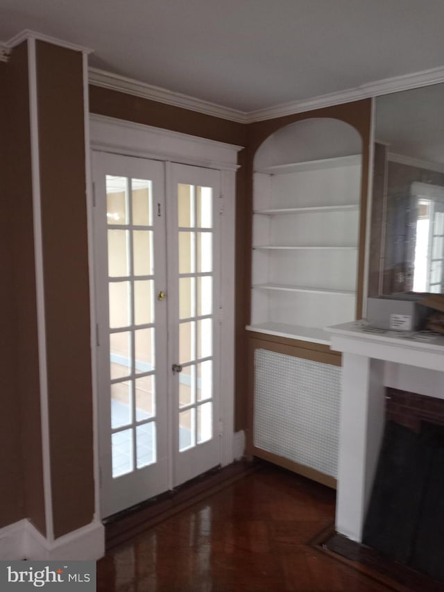 doorway to outside featuring french doors and crown molding