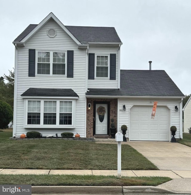 front of property featuring a front yard and a garage