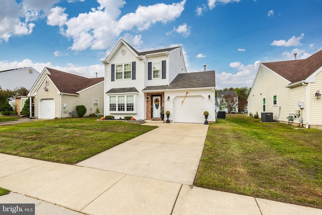 view of front facade featuring a garage, central AC, and a front yard