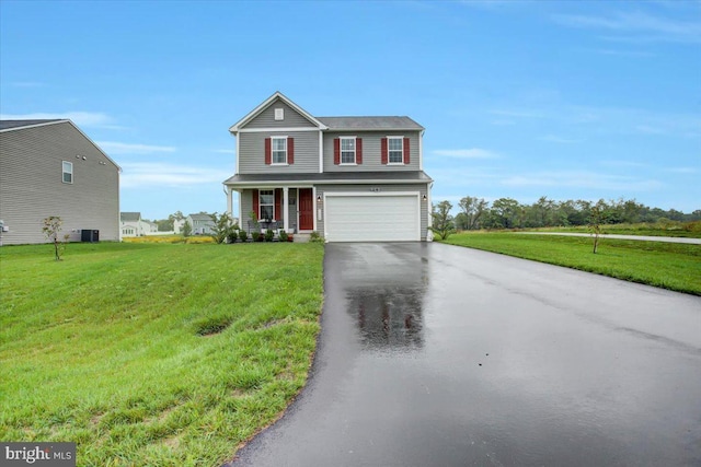 view of front of house with a garage, a front lawn, and central AC unit