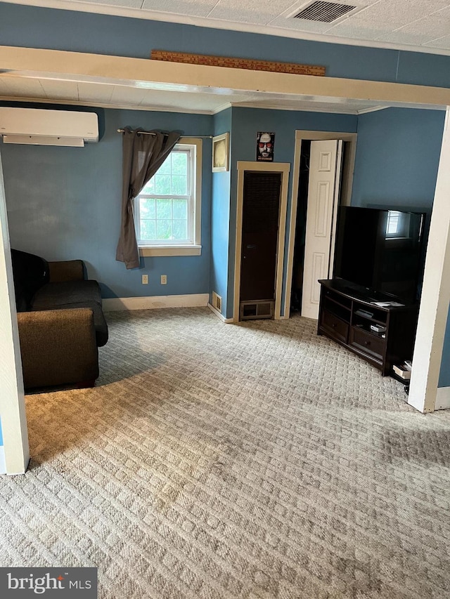 unfurnished living room with carpet flooring and a wall unit AC