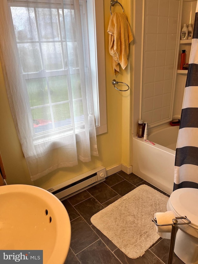 bathroom featuring a baseboard radiator, shower / bath combo, tile patterned flooring, and toilet