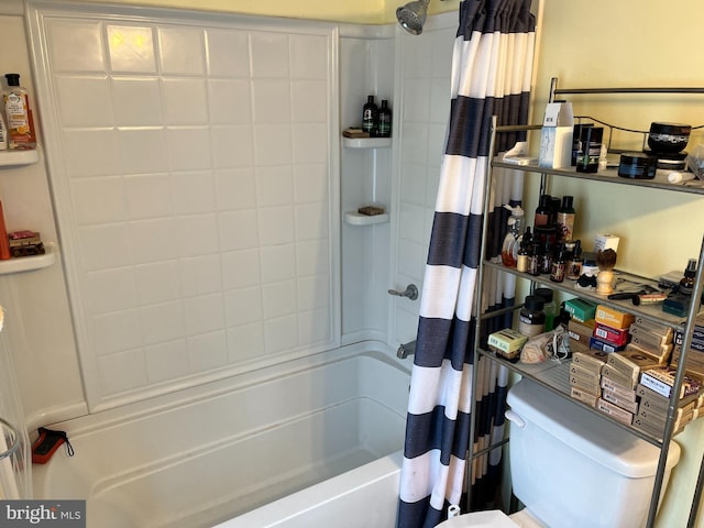 bathroom with toilet and shower / tub combo with curtain