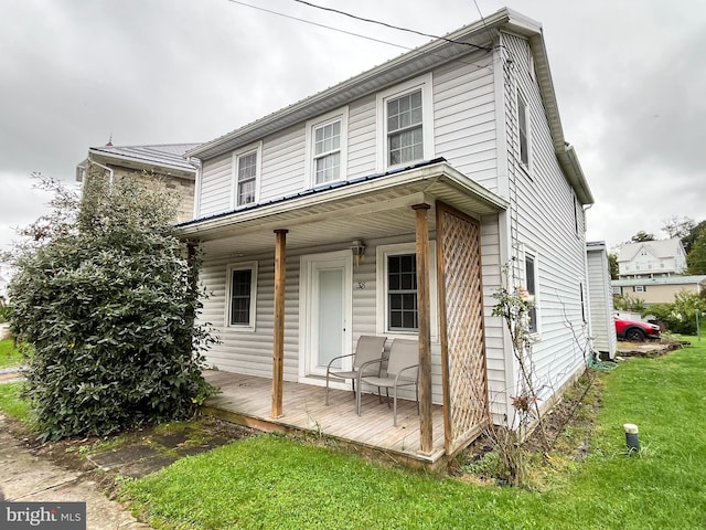 view of front of home with a front lawn and covered porch