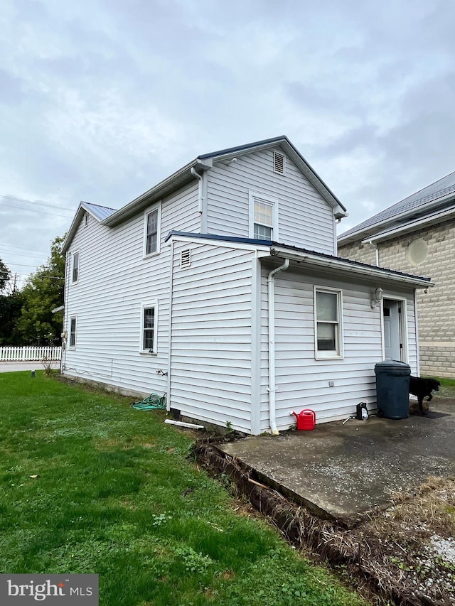 view of property exterior with a yard