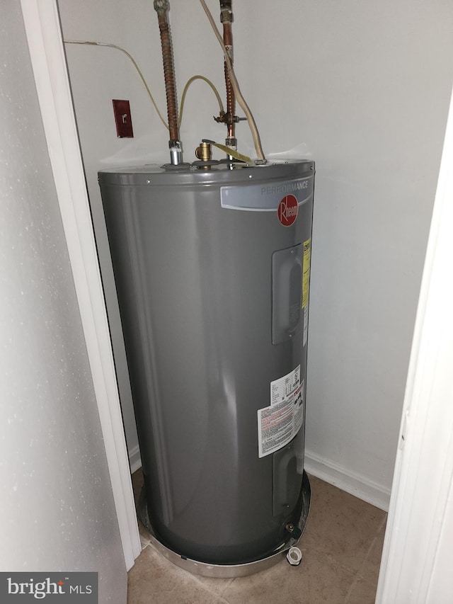 utility room with electric water heater