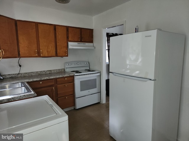 kitchen with white appliances, washer / clothes dryer, and sink