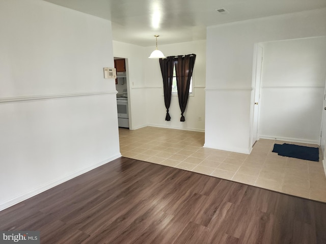 spare room with light hardwood / wood-style floors