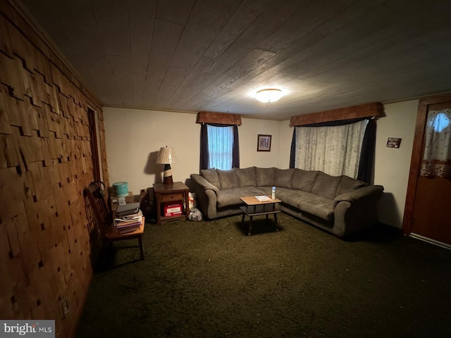 carpeted living room with wood ceiling