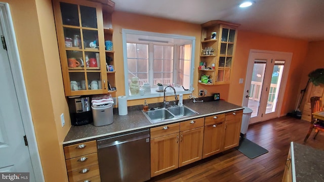 kitchen featuring dark hardwood / wood-style flooring, a wealth of natural light, sink, and dishwasher