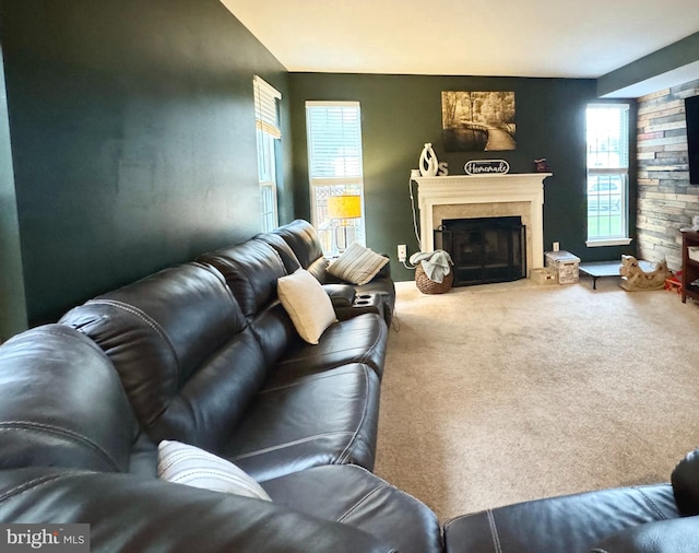 living room featuring carpet floors and a fireplace