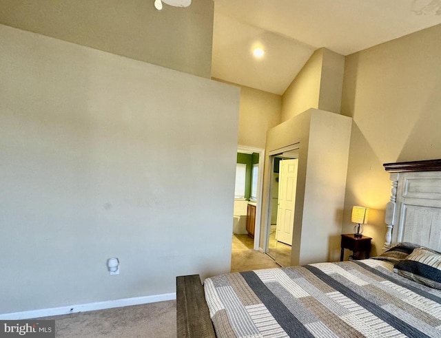 unfurnished bedroom with ensuite bath, baseboards, and light colored carpet