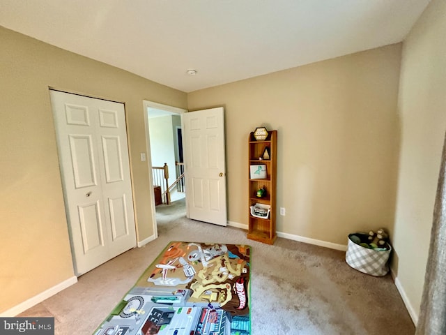 carpeted bedroom featuring a closet