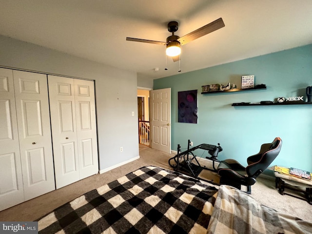 workout area with carpet, ceiling fan, and baseboards