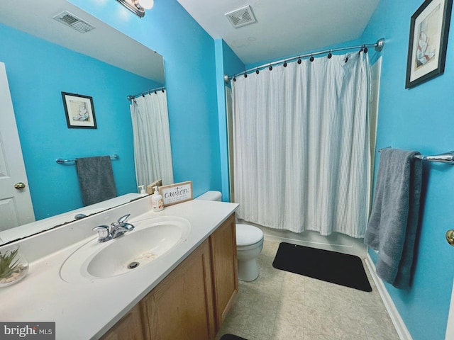 bathroom with toilet, visible vents, and vanity