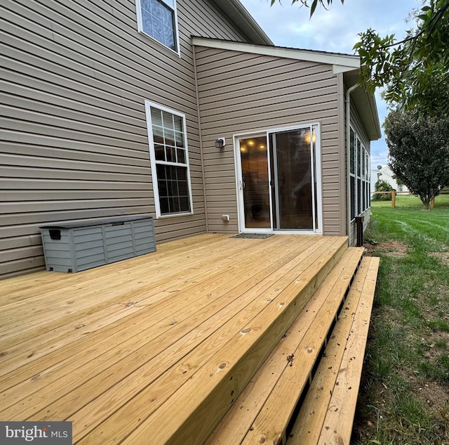 wooden deck with a yard