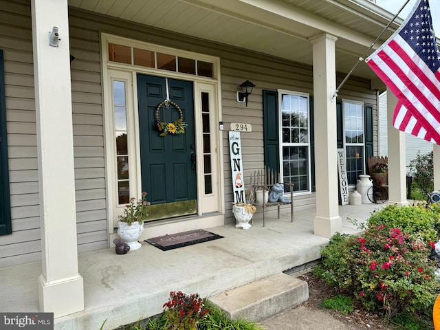 entrance to property with covered porch