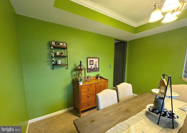 home office featuring carpet floors, baseboards, a tray ceiling, and ornamental molding