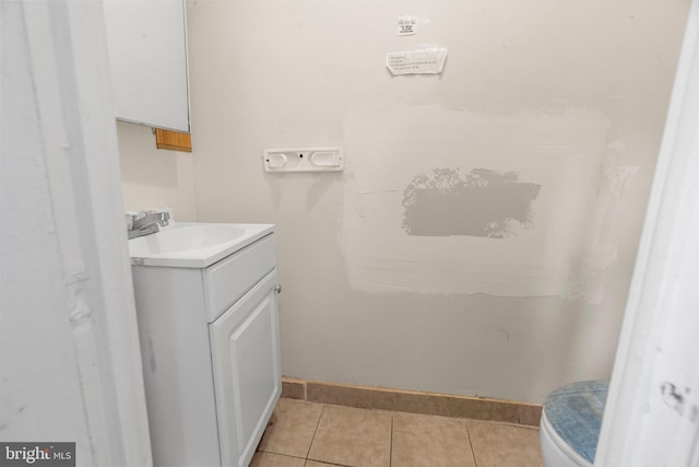 bathroom featuring vanity, toilet, and tile patterned floors