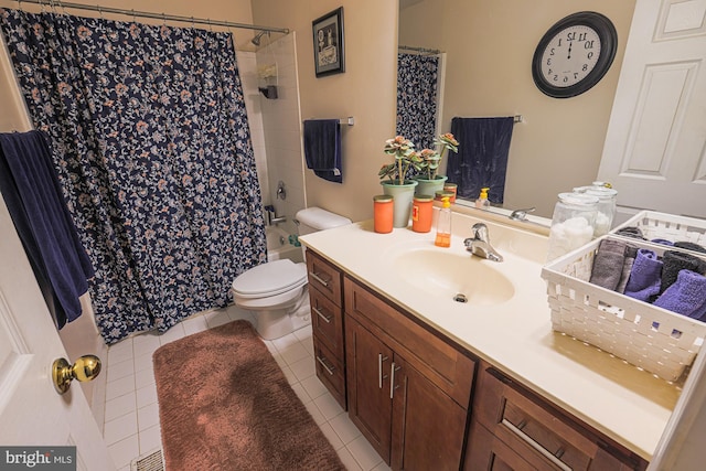 full bathroom with shower / tub combo with curtain, vanity, toilet, and tile patterned floors