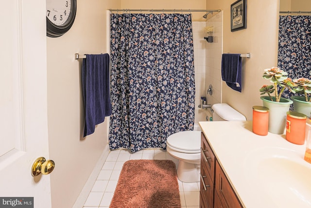 bathroom with vanity, toilet, a shower with shower curtain, and tile patterned floors