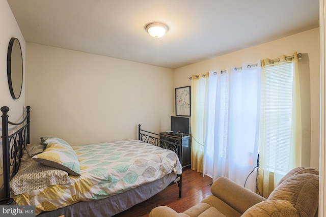 bedroom featuring dark hardwood / wood-style floors