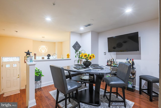 dining space featuring dark hardwood / wood-style flooring