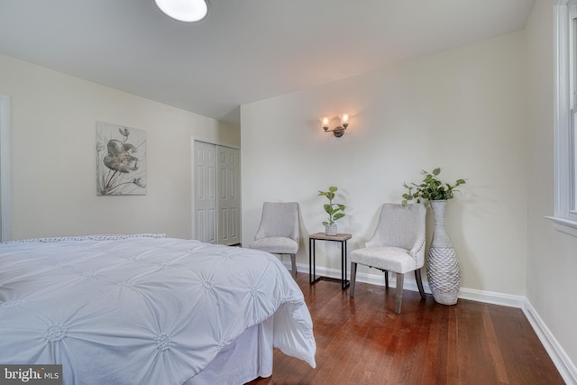 bedroom featuring a closet and dark hardwood / wood-style floors