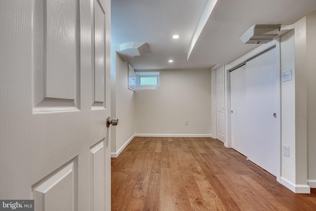 basement featuring light wood-type flooring