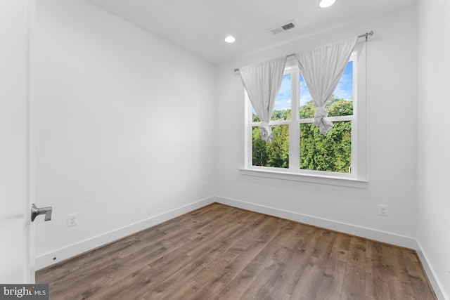 empty room featuring hardwood / wood-style flooring