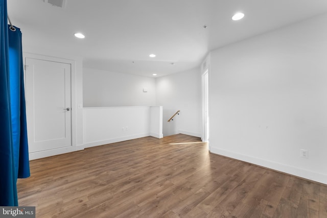 spare room featuring hardwood / wood-style flooring