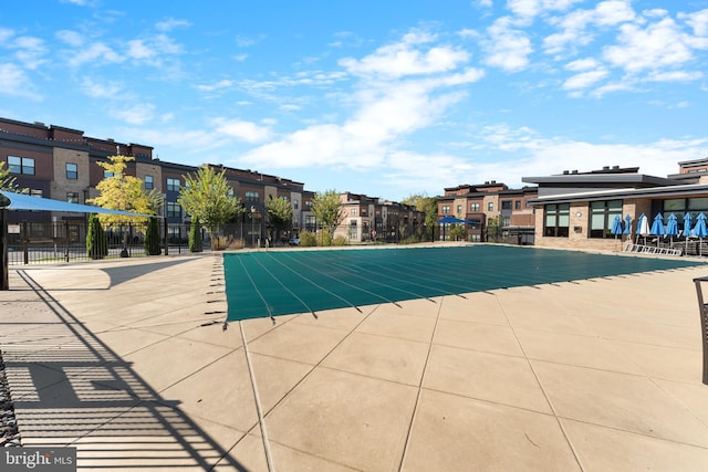 view of pool featuring a patio