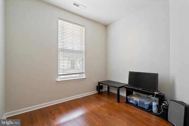 misc room featuring dark hardwood / wood-style floors and a healthy amount of sunlight