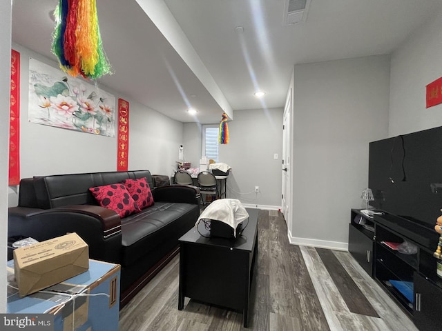 living room featuring dark hardwood / wood-style floors