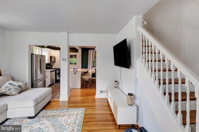 living room with light hardwood / wood-style floors