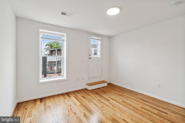 unfurnished room with light hardwood / wood-style flooring