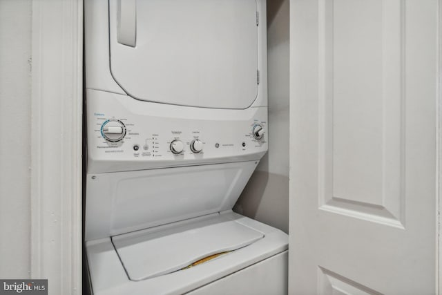 laundry room with stacked washer and dryer