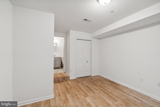 interior space with light hardwood / wood-style flooring and a closet