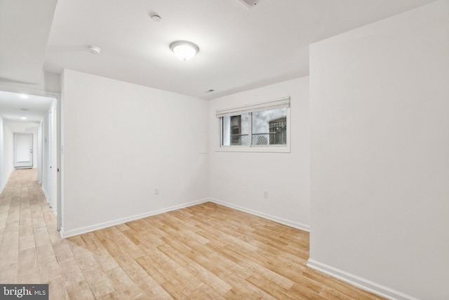 empty room with light hardwood / wood-style floors