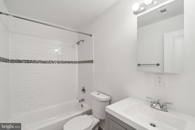 full bathroom featuring vanity, toilet, and tiled shower / bath