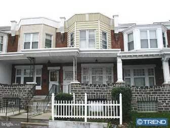 townhome / multi-family property with covered porch