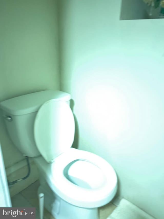 bathroom featuring tile patterned flooring and toilet