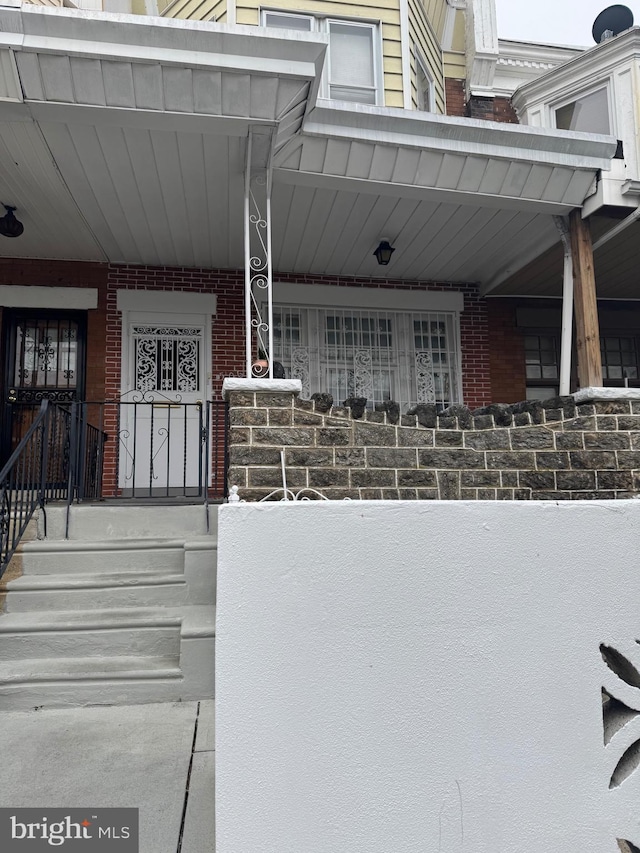 entrance to property with a porch