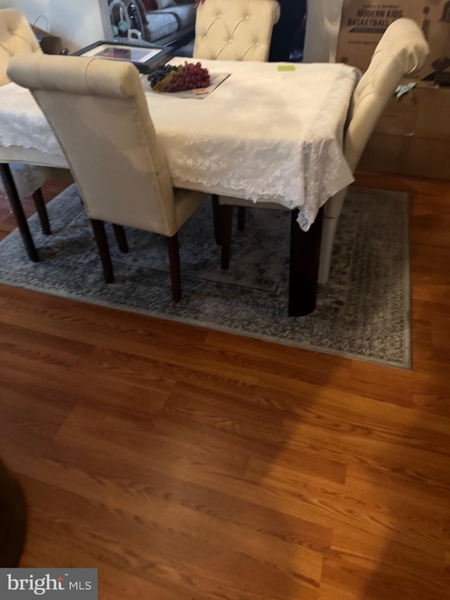 dining space featuring hardwood / wood-style floors