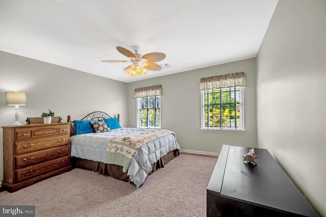 carpeted bedroom featuring ceiling fan