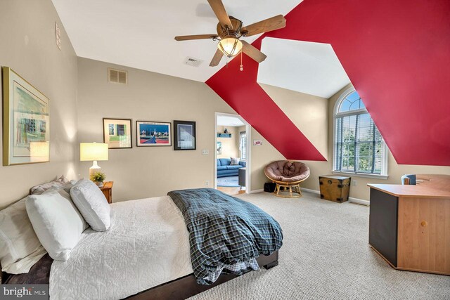 carpeted bedroom with lofted ceiling and ceiling fan