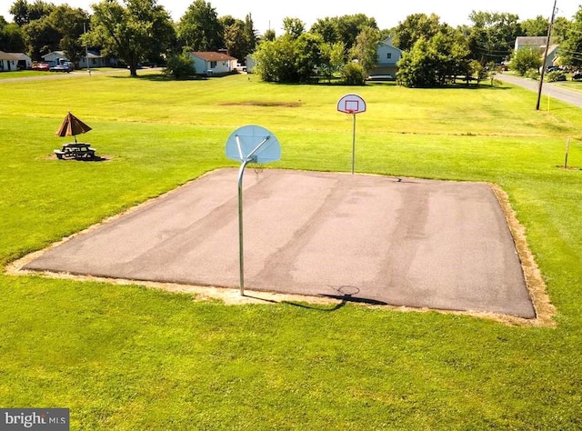 view of home's community with a yard