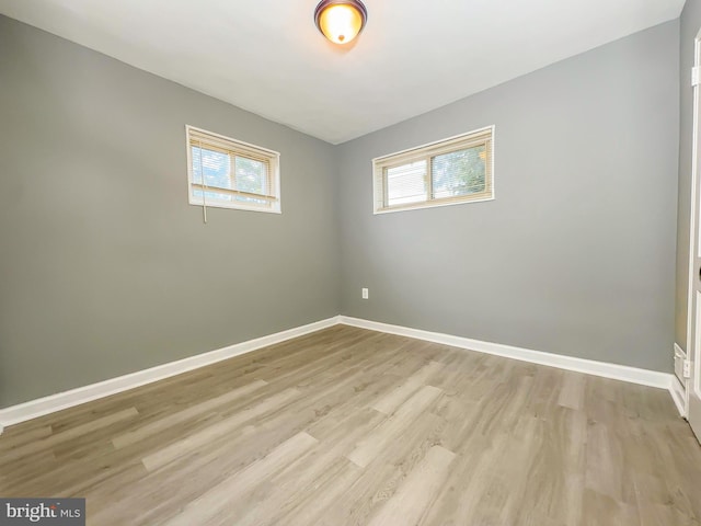 empty room featuring light hardwood / wood-style floors and a wealth of natural light