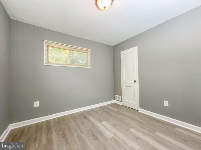 unfurnished room featuring light wood-type flooring