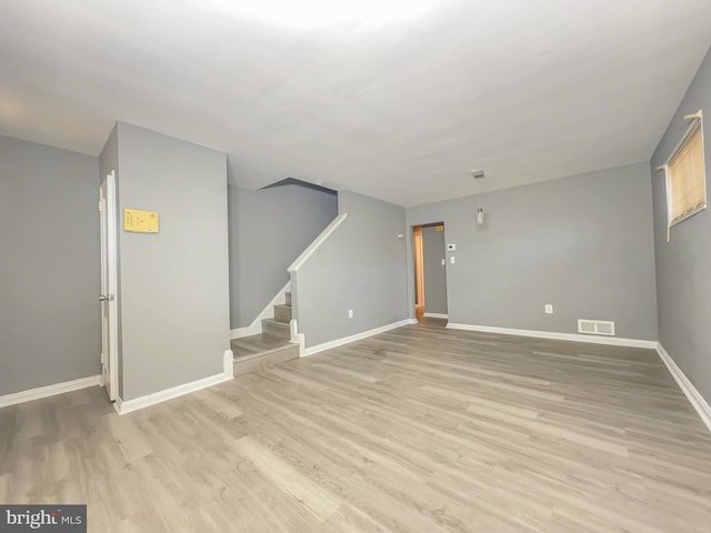 spare room with light wood-type flooring